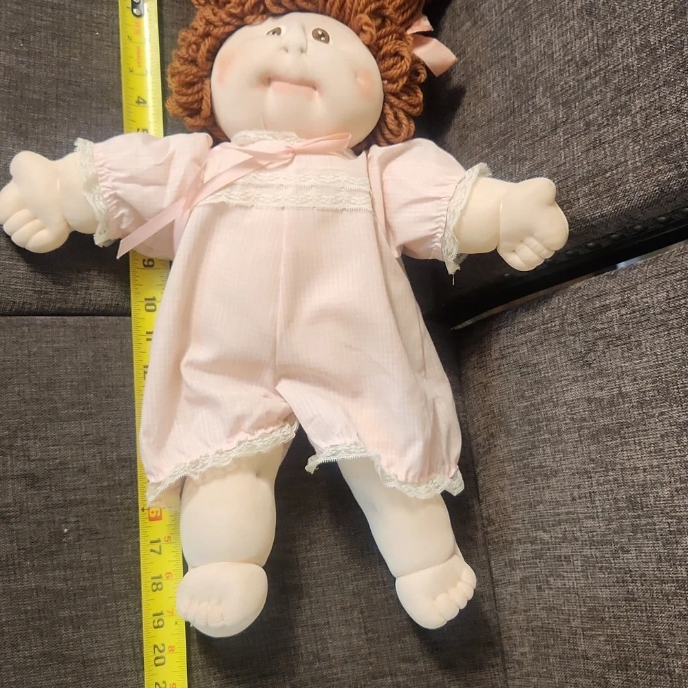 Charming Pink Doll with Curly Brown Hair